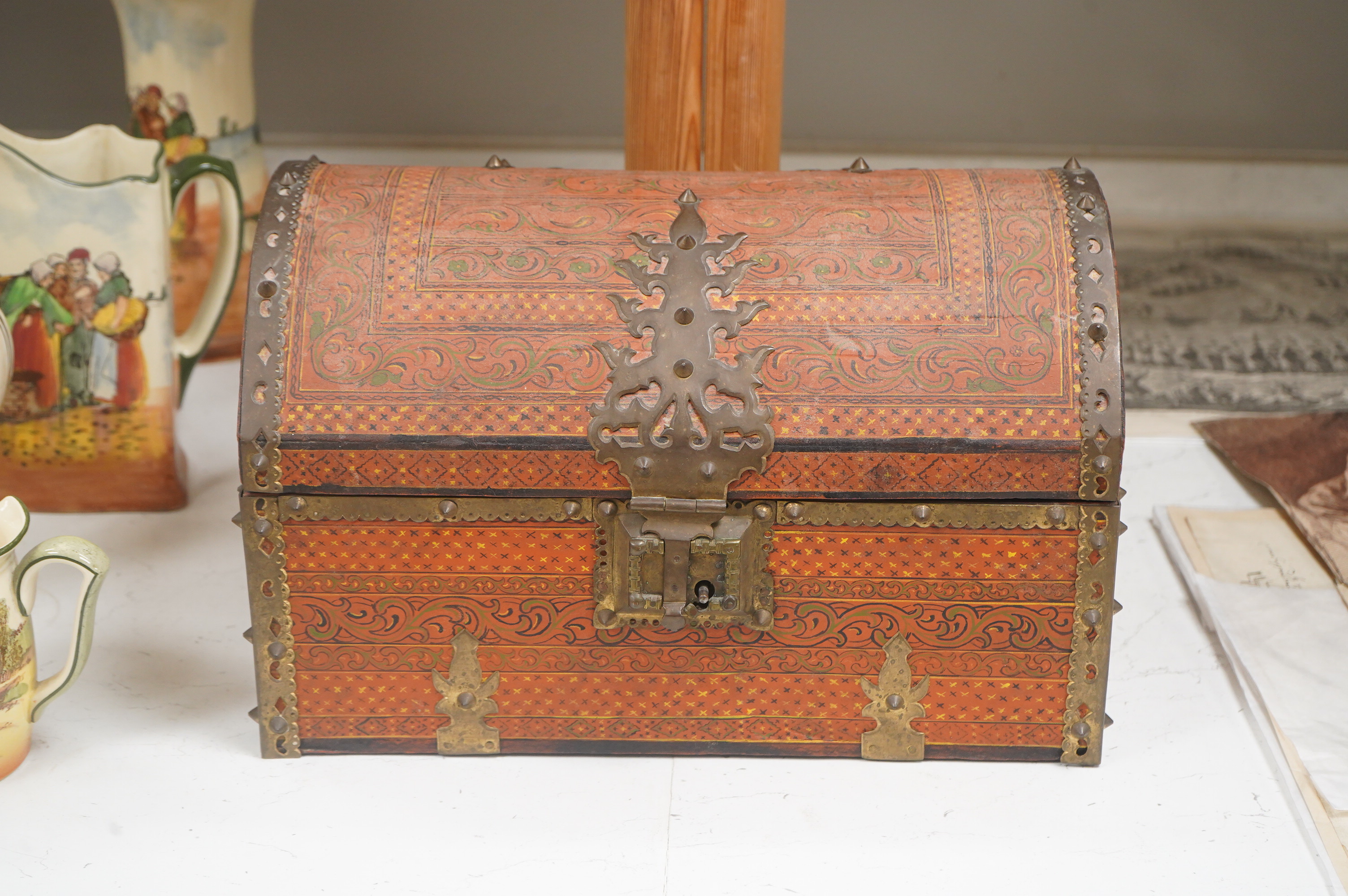 A Tibetan brass mounted painted wood dome casket, 36cm wide